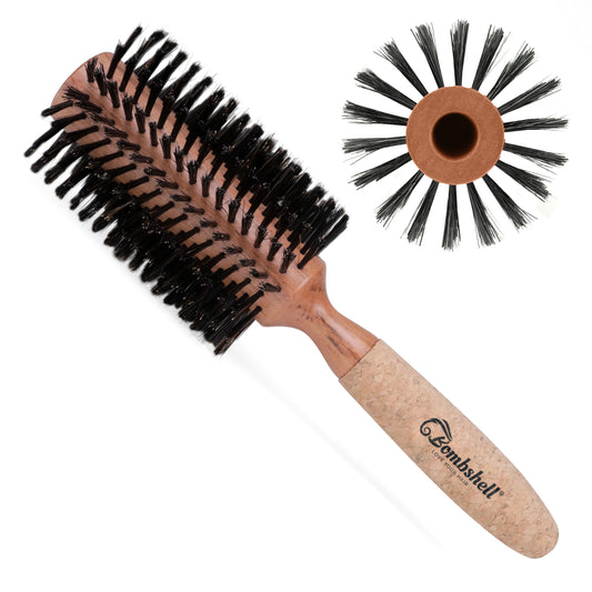 Round hairbrush with black bristles and a cork  wooden handle on a white background, featuring the Bombshell brand.